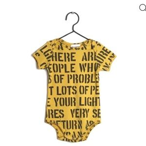 Playful Yellow Graphic Bodysuit for Kids by designer Wolf and Rita